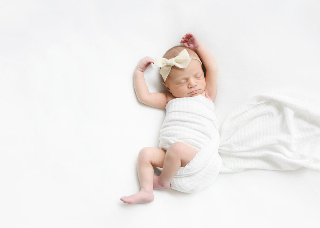 newborn baby in Houston on white blanket