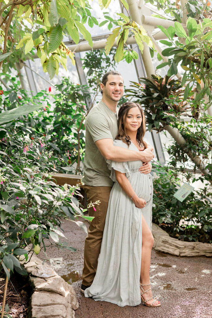 Beautiful couple pose for their maternity photos
