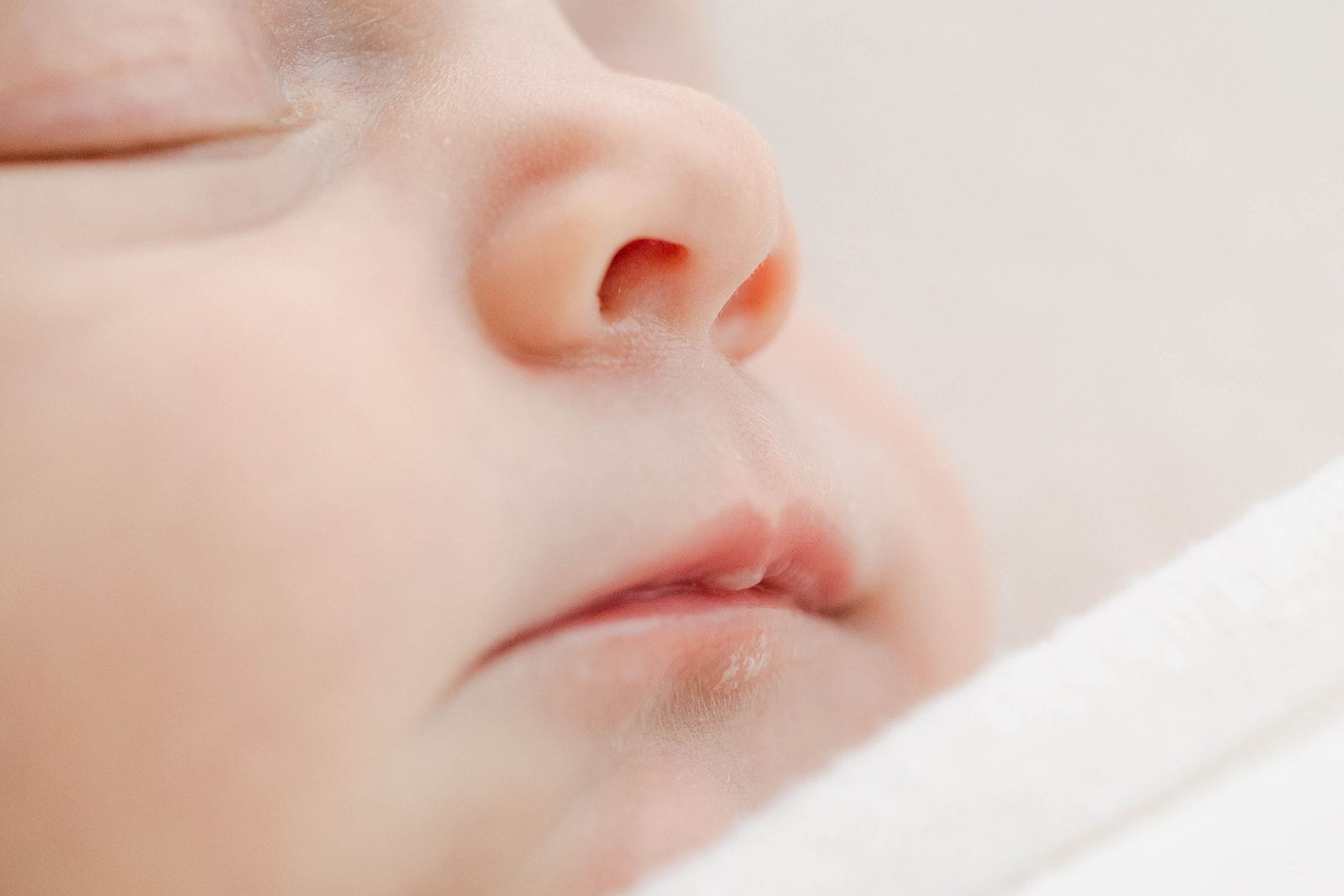 Details of a sleeping newborn baby face after meeting with Houston Postpartum Doulas